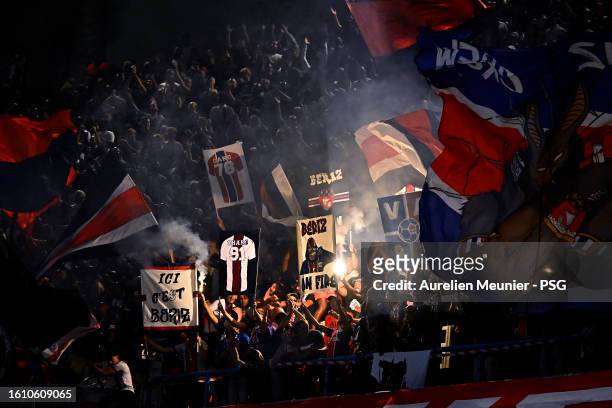 Paris Saint-Germain Ultras fans wave flares and flags during the Ligue 1 Uber Eats match between Paris Saint-Germain and FC Lorient at Parc des...