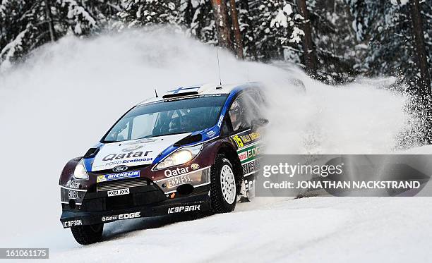 Finland's Juho Hanninen and his co-driver Tomi Tuominen steer their Ford Fiesta RS WRC during Sagen stage, the 9th of Rally Sweden, second round of...