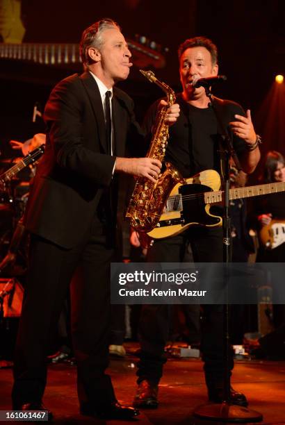 Jon Stewart and Bruce Springsteen perform onstage at MusiCares Person Of The Year Honoring Bruce Springsteen at Los Angeles Convention Center on...