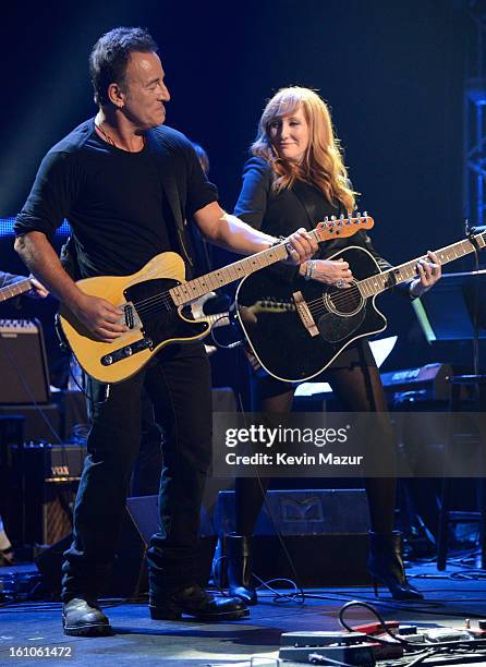 Bruce Springsteen and Patti Scialfa perform onstage at MusiCares Person Of The Year Honoring Bruce Springsteen at Los Angeles Convention Center on...