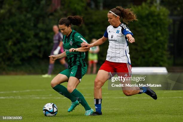 Kristina Bartsch of Borussia Moenchengladbach and Larissa Muehlhaus of Hamburg compete for the ball during the 2. Frauen Bundesliga match between...