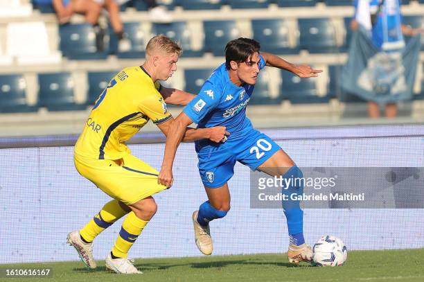 Josh Doig of Hellas Verona FC in action against Matteo Cancellieri of Empoli FC during the Serie A TIM match between Empoli FC and Hellas Verona FC...