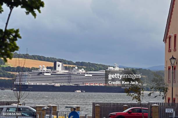 The Holland America Line cruise ship Nieuw Statendam looms large between the houses on the Fife shore as she lies at anchor near the Forth Bridge,...