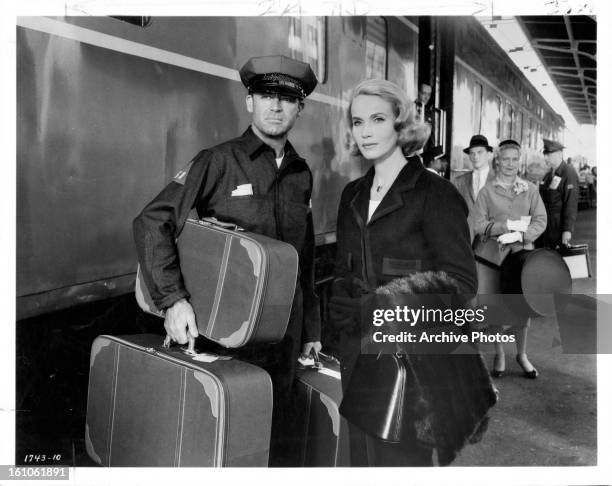 Eva Marie Saint helps a disguised Cary Grant elude the police in a scene from the film 'North By Northwest', 1959.