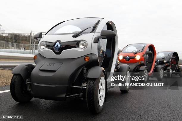 Picture taken on December 20, 2011 shows new Renault electric cars Twizy Z.E at a standstill on a test track, at the Ile Séguin test centre for...