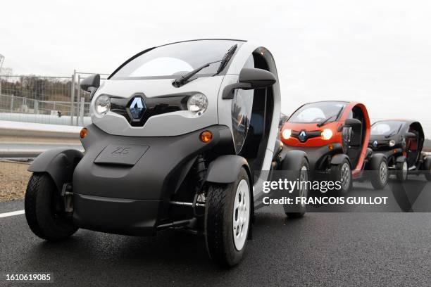 New Renault electric car Twizy Z.E are at a standstill on a test track, on December 20, 2011 at the Ile Séguin test centre for electric vehicles in...