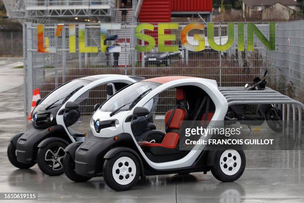 Picture taken on December 20, 2011 shows new Renault electric cars Twizy Z.E, on a test track, at the Ile Séguin test centre for electric vehicles in...