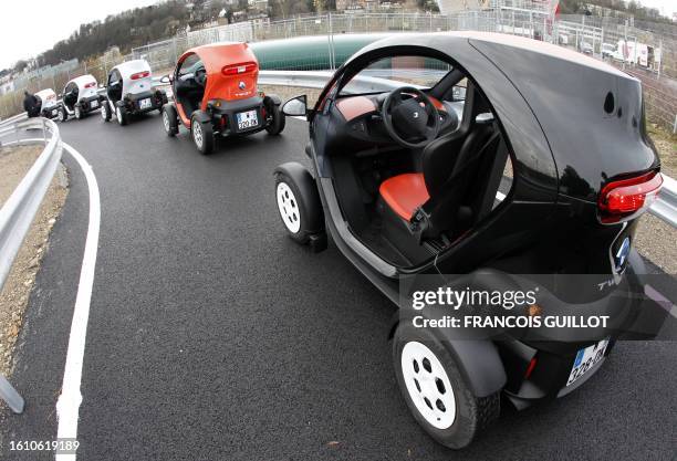 Picture taken on December 20, 2011 shows new Renault electric cars Twizy Z.E at a standstill on a test track, at the Ile Séguin test centre for...