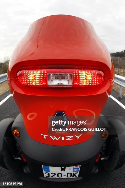 The back of a new Renault electric car Twizy Z.E is pictured on December 20, 2011 at the Ile Séguin test centre for electric vehicles in...