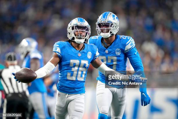 Steven Gilmore of the Detroit Lions and Saivion Smith of the Detroit Lions reacts after Gilmore made an interception against the Jacksonville Jaguars...