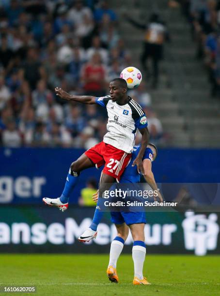 Jean-Luc Dompe of Hamburg fights for the ball with Jonjoe Kenny of Berlin during the Second Bundesliga match between Hamburger SV and Hertha BSC at...