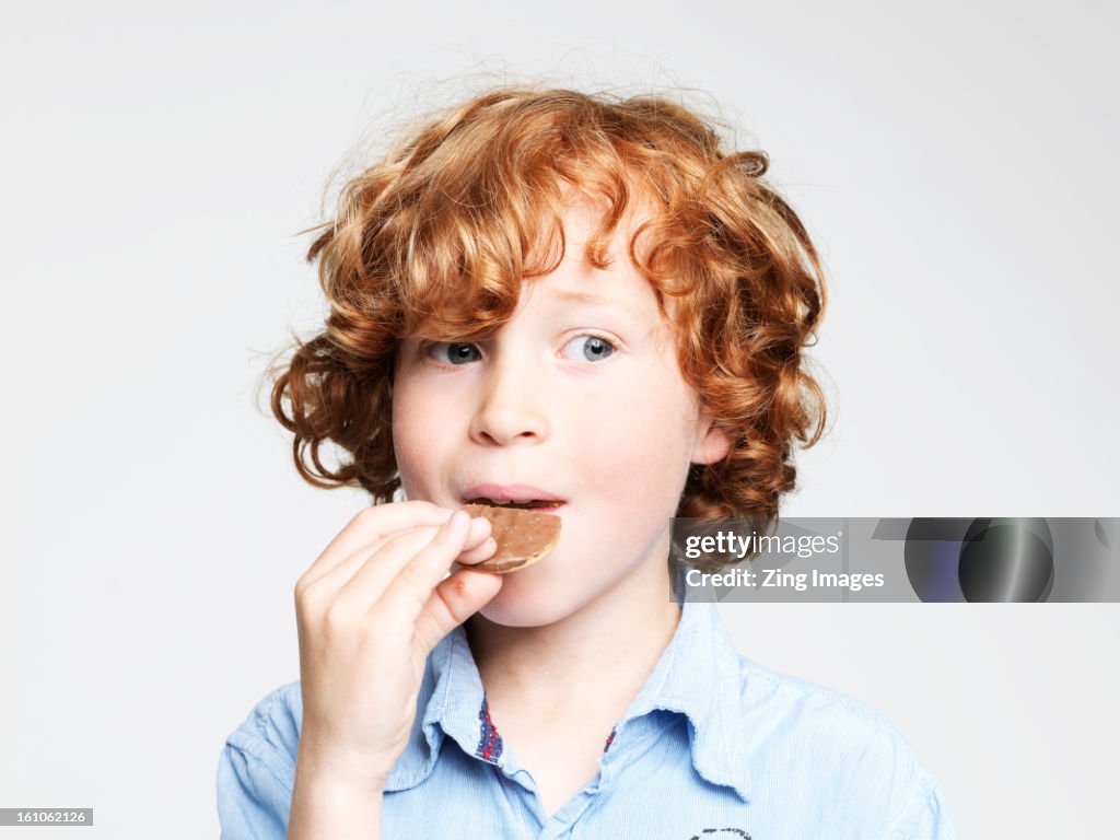 Boy eating cookie