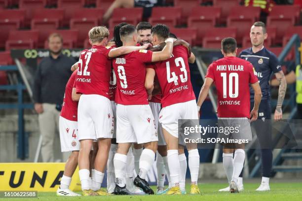 Wisla Krakow players celebrate a goal during the Fortuna 1 Polish League 2023/2024 football match between Wisla Krakow and Odra Opole at Krakow...