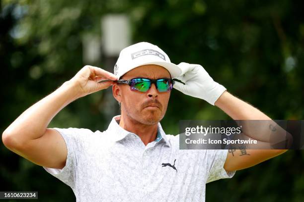 Golfer Rickie Fowler adjusts his sunglasses on the 2nd tee during the third round of the BMW Championship Fed Ex Cup Playoffs on August 19th at...