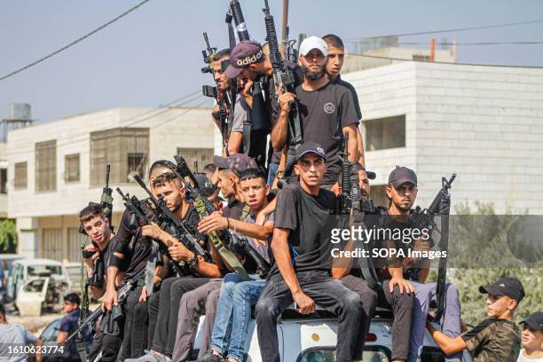 Dozens of armed Palestinians appear, carrying their weapons while roaming the city of Nablus with joy and applause, after a Palestinian launched a...