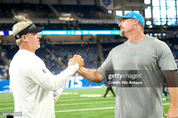 Head coach Doug Pederson of the Jacksonville Jaguars shakes hands with head coach Dan Campbell of the Detroit Lions after the preseason game at Ford...