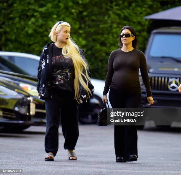 Alabama Barker and Kourtney Kardashian are seen leaving Cecconi's on August 18, 2023 in Los Angeles, California.