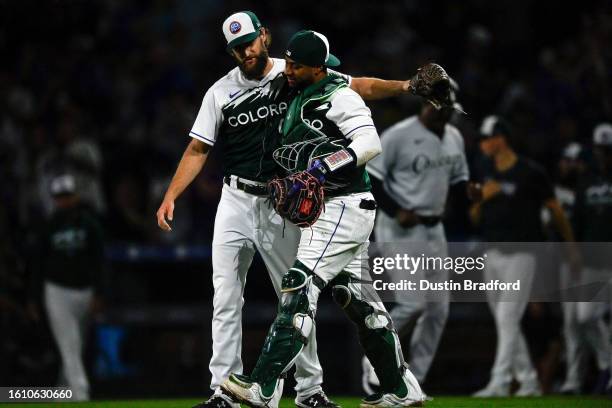 Jake Bird of the Colorado Rockies celebrates with Elias Diaz after their team's win against the Chicago White Sox at Coors Field on August 19, 2023...