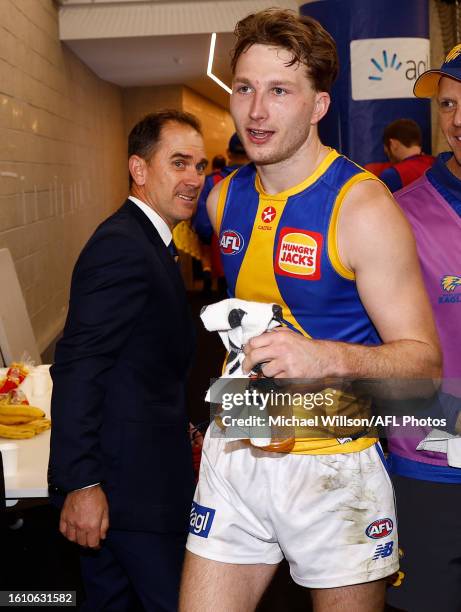 Justin Langer celebrates with Alex Witherden of the Eagles during the 2023 AFL Round 23 match between the Western Bulldogs and the West Coast Eagles...