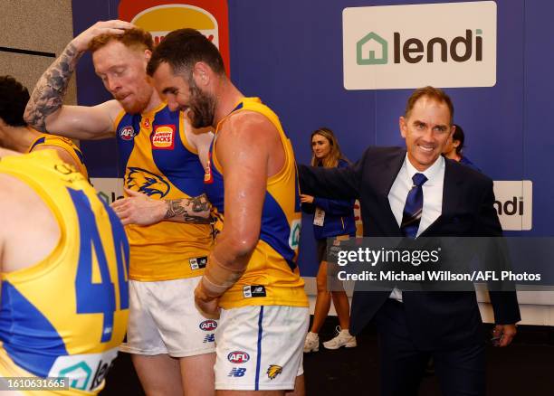 Justin Langer celebrates with Eagles players during the 2023 AFL Round 23 match between the Western Bulldogs and the West Coast Eagles at Marvel...