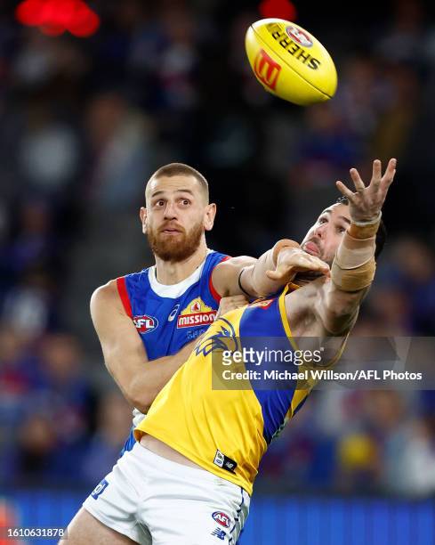 Liam Jones of the Bulldogs and Jack Darling of the Eagles compete for the ball during the 2023 AFL Round 23 match between the Western Bulldogs and...
