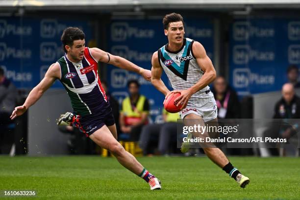 Connor Rozee of the Power runs with the ball during the 2023 AFL Round 23 match between the Fremantle Dockers and the Port Adelaide Power at Optus...