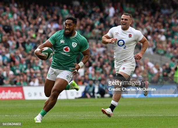 Bundee Aki of Ireland runs in to score his side's opening try during the Summer International match between Ireland and England at Aviva Stadium on...