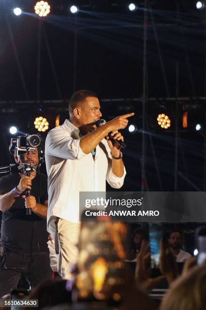 Egyptian singer Amr Diab performs at the Beirut Waterfront Arena in the Lebanese capital late on August 19, 2023.