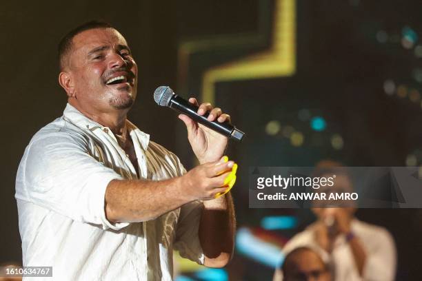 Egyptian singer Amr Diab performs at the Beirut Waterfront Arena in the Lebanese capital late on August 19, 2023.