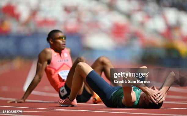 Budapest , Hungary - 20 August 2023; Chris O'Donnell of Ireland, right, after competing in the men's 400m heats during day two of the World Athletics...