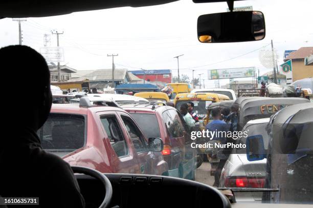 Motorists groan inside traffic jams at Ota in Ogun State, Nigeria, on Saturday, August 19, 2023. Nigerians are eager to benefit from the government...