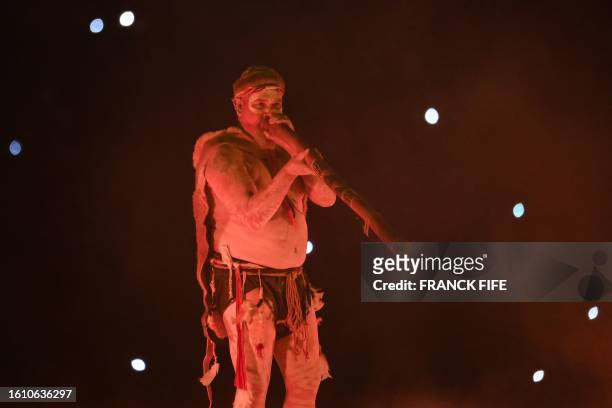 Musician plays a didgeridoo during the closing ceremony of the Australia and New Zealand 2023 Women's World Cup final football match between Spain...