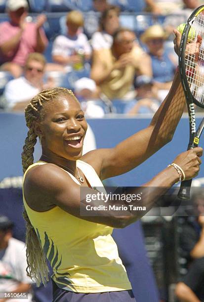 Tennis player Serena Williams waves to the crowd during Arthur Ashe Kids'' Day August 25, 2001 at the USTA National Tennis Center in Flushing...