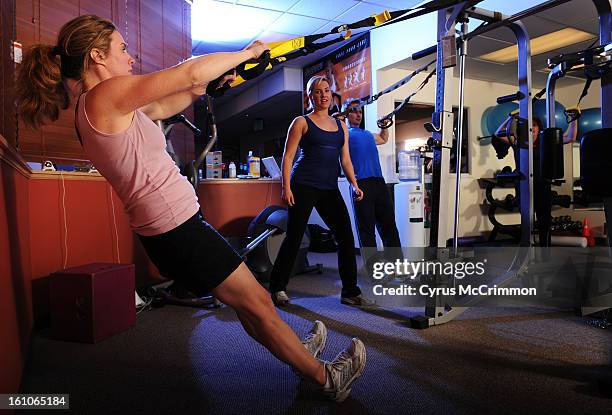 Fitness instructor Anne Parker leads a class using the TRX Suspension system at the Healthstyles Equipment at 1555 S. Colorado Blvd on Wednesday,...