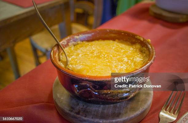 polenta with cheese - valle daosta stock pictures, royalty-free photos & images