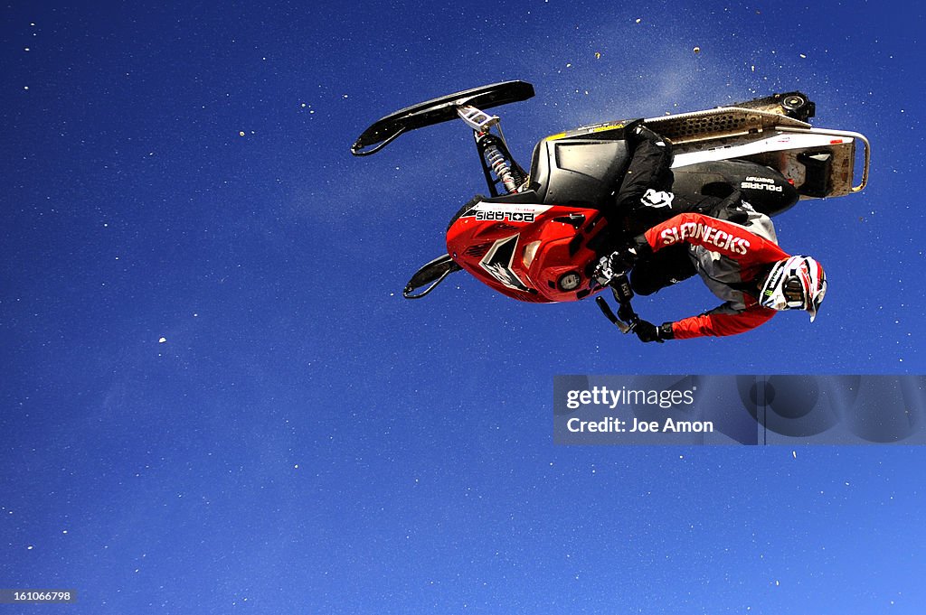 (EL) sp21oexxgames16e Sam Rogers 20, of Bozeman, MT. sails across the sky upside down while diong a back flip at a practice session on Chris Burandt's land in Kremmling. Joe Amon / The Denver Post