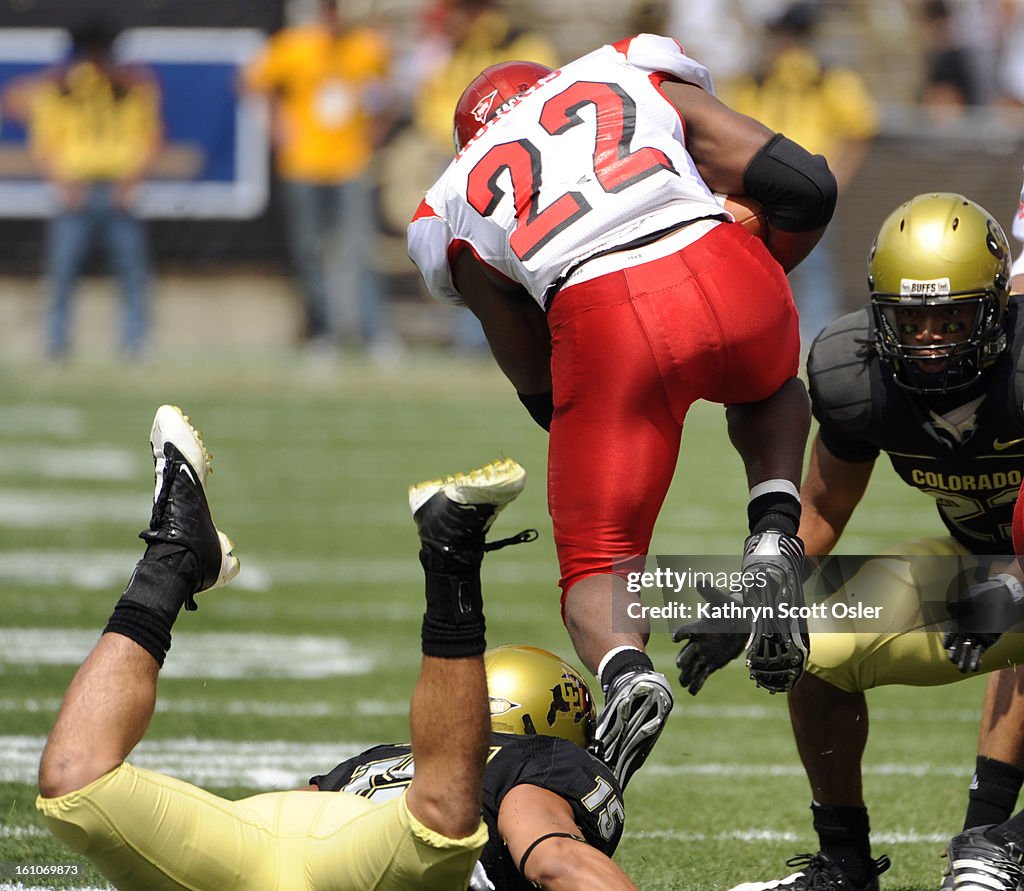 (KO) FBCCU06_KSO_9_6_08695 - The University of Colorado Buffaloes football team takes on the Eastern Washington Eagles at Folsom Field in Boulder during the first half of play. Eastern Washington's Dale Morris (22) jumps over CU free safety Ryan Walters (