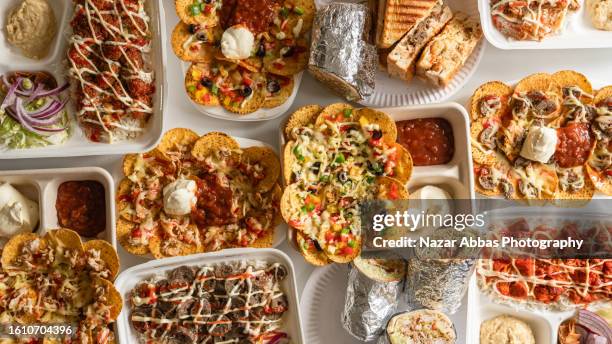 indian fusion food table. - nazar abbas photography stock pictures, royalty-free photos & images