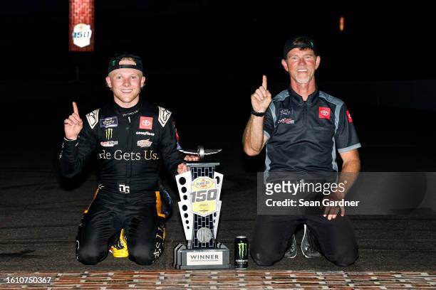 Ty Gibbs, driver of the He Gets Us Toyota, and crew chief Jason Ratcliff celebrates at the bricks after winning the NASCAR Xfinity Series Pennzoil...