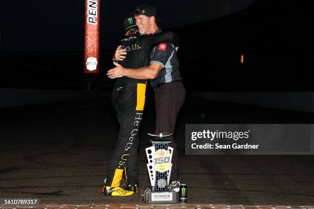 Ty Gibbs, driver of the He Gets Us Toyota, and crew chief Jason Ratcliff celebrates at the bricks after winning the NASCAR Xfinity Series Pennzoil...