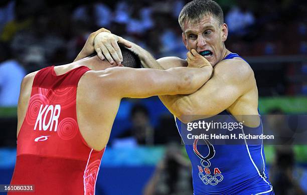 Adam Wheeler, right, battles it out with Korea's Han Tae-Young during their bout. Adam Wheeler, of Lancaster, California but who trains in Colorado...