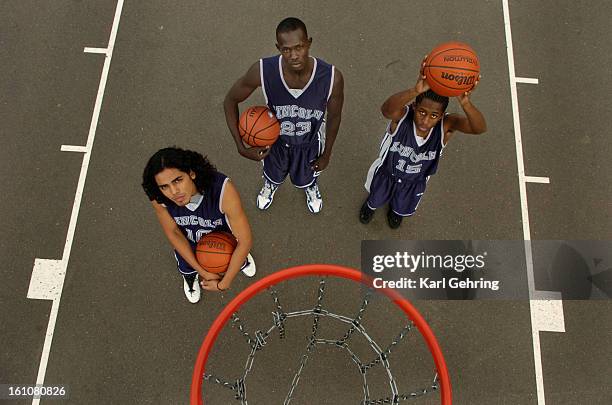 Abraham Lincoln High School basketball players Ruot Pal, Jorge Gutierrez, left, Ruot Pal, center, and Kadeem Thomas, right. The three starters each...