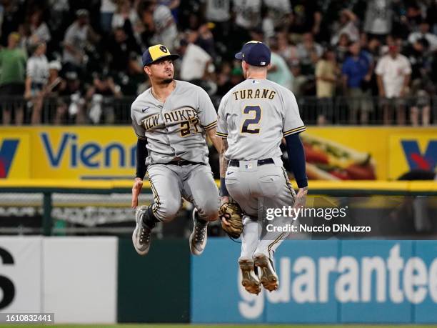 Willy Adames and Brice Turang of the Milwaukee Brewers celebrate their win over the Chicago White Sox at Guaranteed Rate Field on August 12, 2023 in...