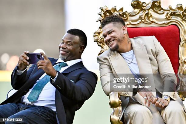 Member, Ken Griffey Jr. And Seattle Mariners great, Felix Hernandez, take a selfie during the Hall of Fame inductee ceremony before the game between...