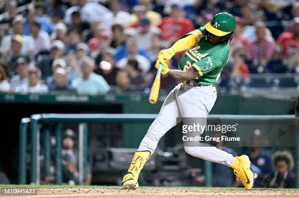 Lawrence Butler of the Oakland Athletics hits a double in the seventh inning for his first Major League hit against the Washington Nationals at...