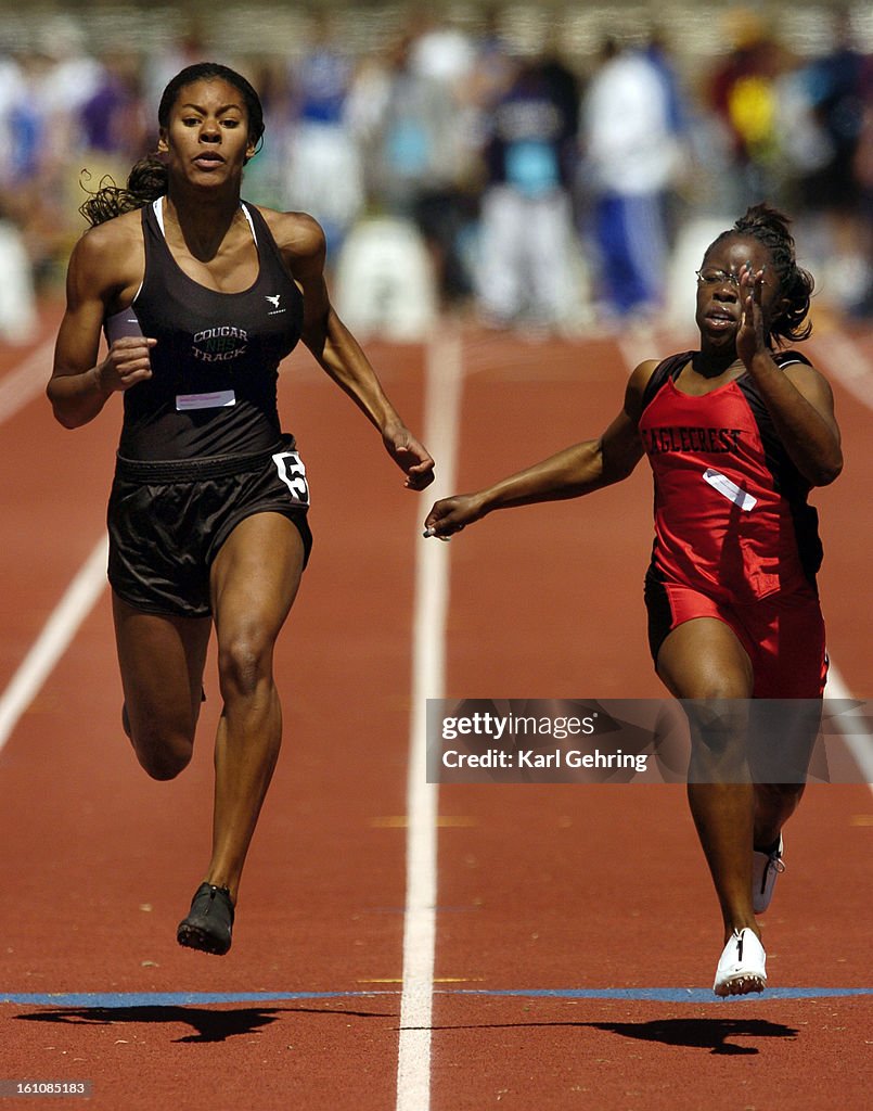 DENVER, CO (04-08-2006) -- Eaglecrest High School sprinter Ashley Cruder, right, edged Grifin Mather, left, from Niwot, to win the girl's 100 meter dash Saturday. The Mullen Runners Roost track and field meet was held at Mullen High School, 3601 S. Lowell