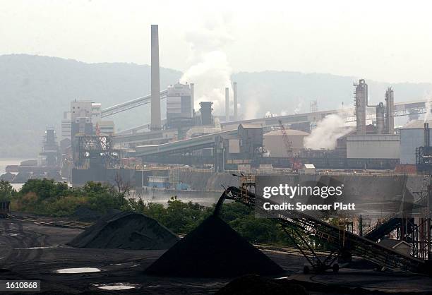 Smoke billows from a coal powered steel plant August 26, 2001 in western, PA. The coal mining industry, once nearly extinct in Pennsylvania, has made...