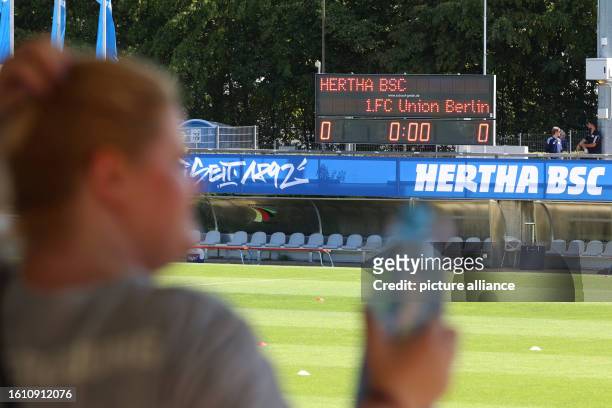 August 2023, Berlin: Regionalliga women: Hertha BSC - Union Berlin. The Hanns-Braun-Stadion scoreboard shows 0:0 before the women's Regionalliga...