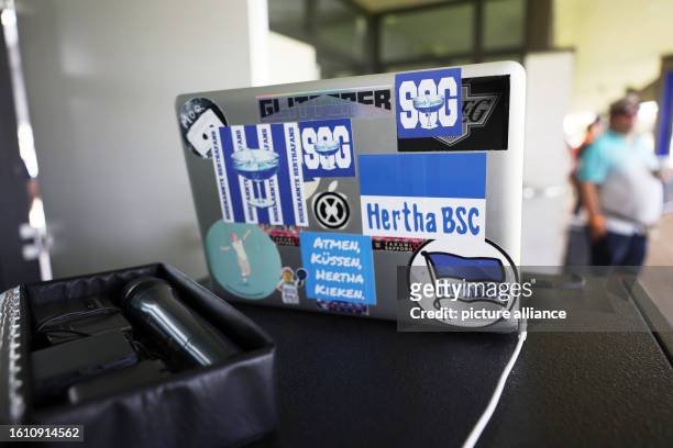 August 2023, Berlin: Regionalliga women: Hertha BSC - Union Berlin. A computer with various Hertha stickers is seen before the women's regional...