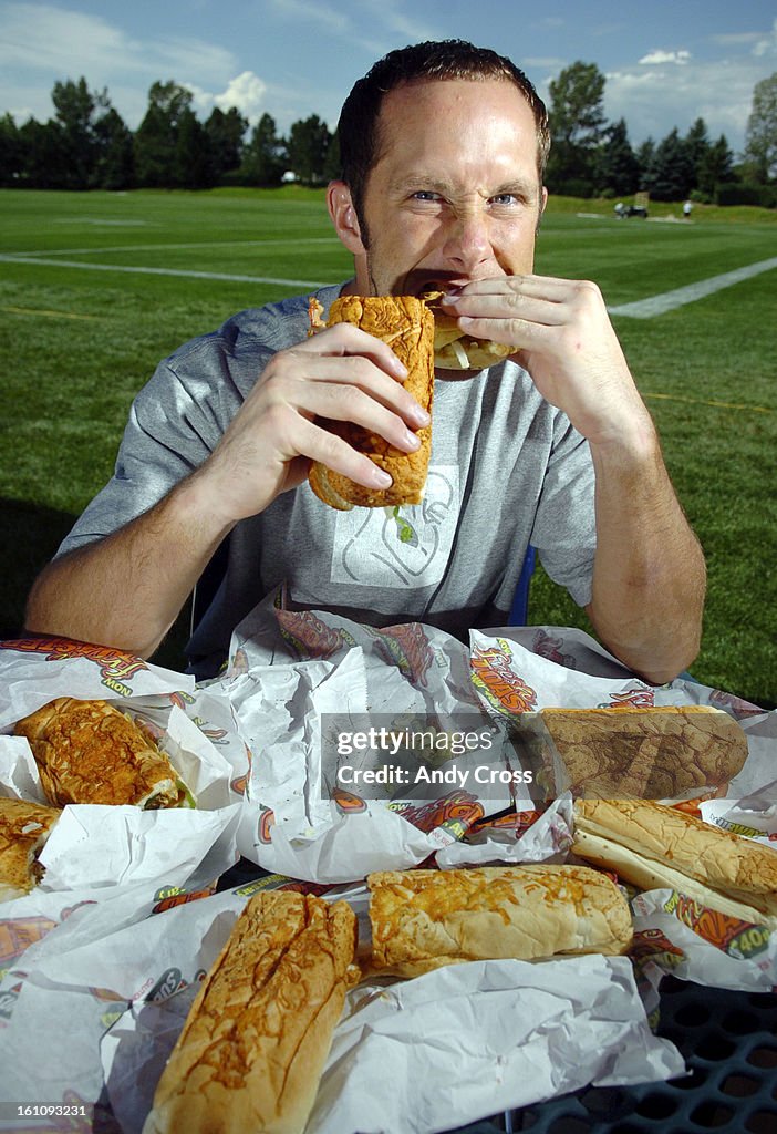 CENTENNIAL,CO--AUGUST 15TH 2006--Denver Broncos wide receiver, David Kircus, <Cq> eats a Subway sandwich, his presonal favorite; a Roasted Chicken Breast with bacon and salami, <cq> after training camp Tuesday morning at Dove Valley. Kircus worked for Sub